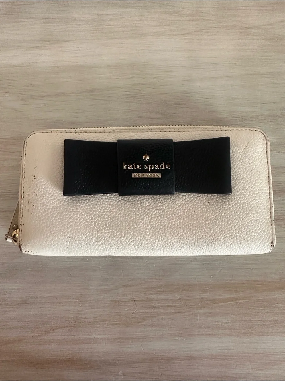 kate spade Cream Zip-Around Wallet with Black Bow